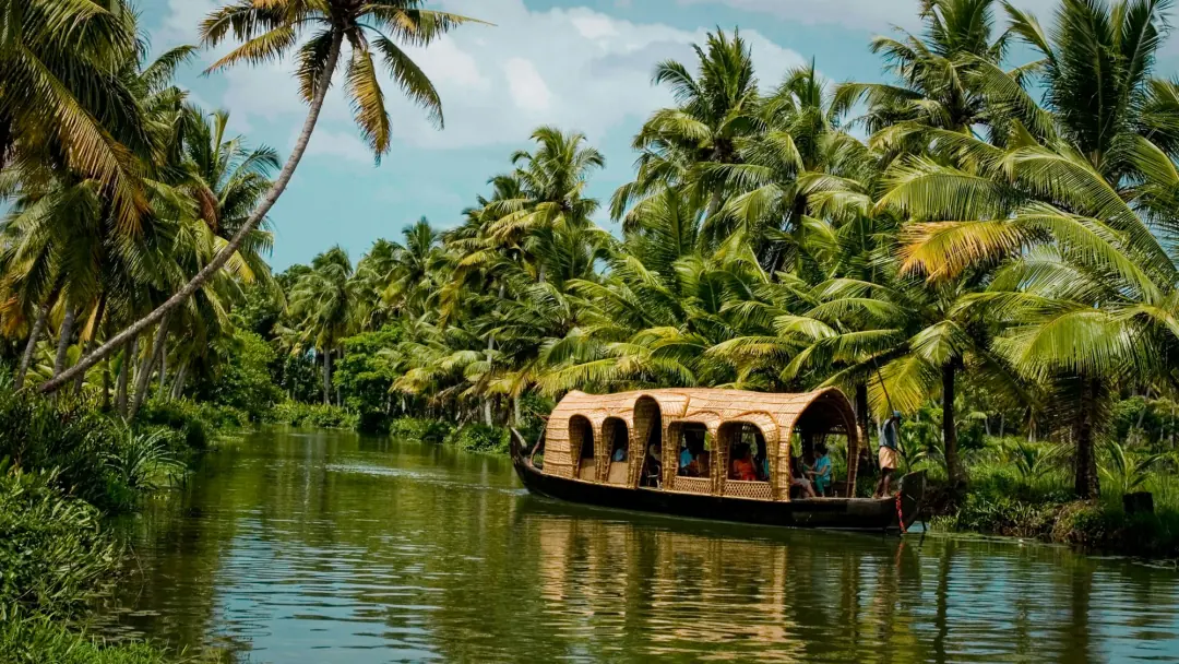 A houseboat moving through the Kerala backwaters